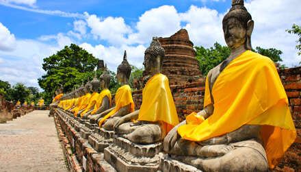 Stone statue of a Buddha in Ayutthaya, Thailand.