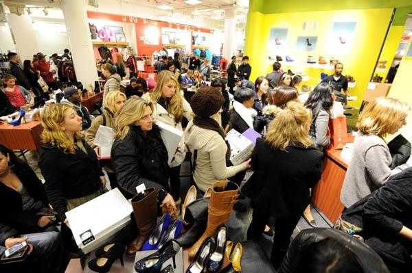 People stand in line to make purchases i